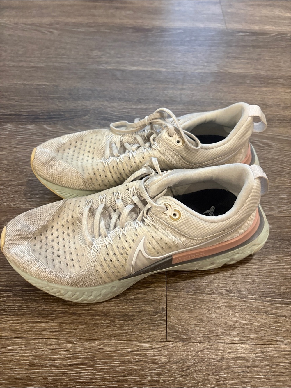 Nike Women's Beige Running Shoes with Pink Accent